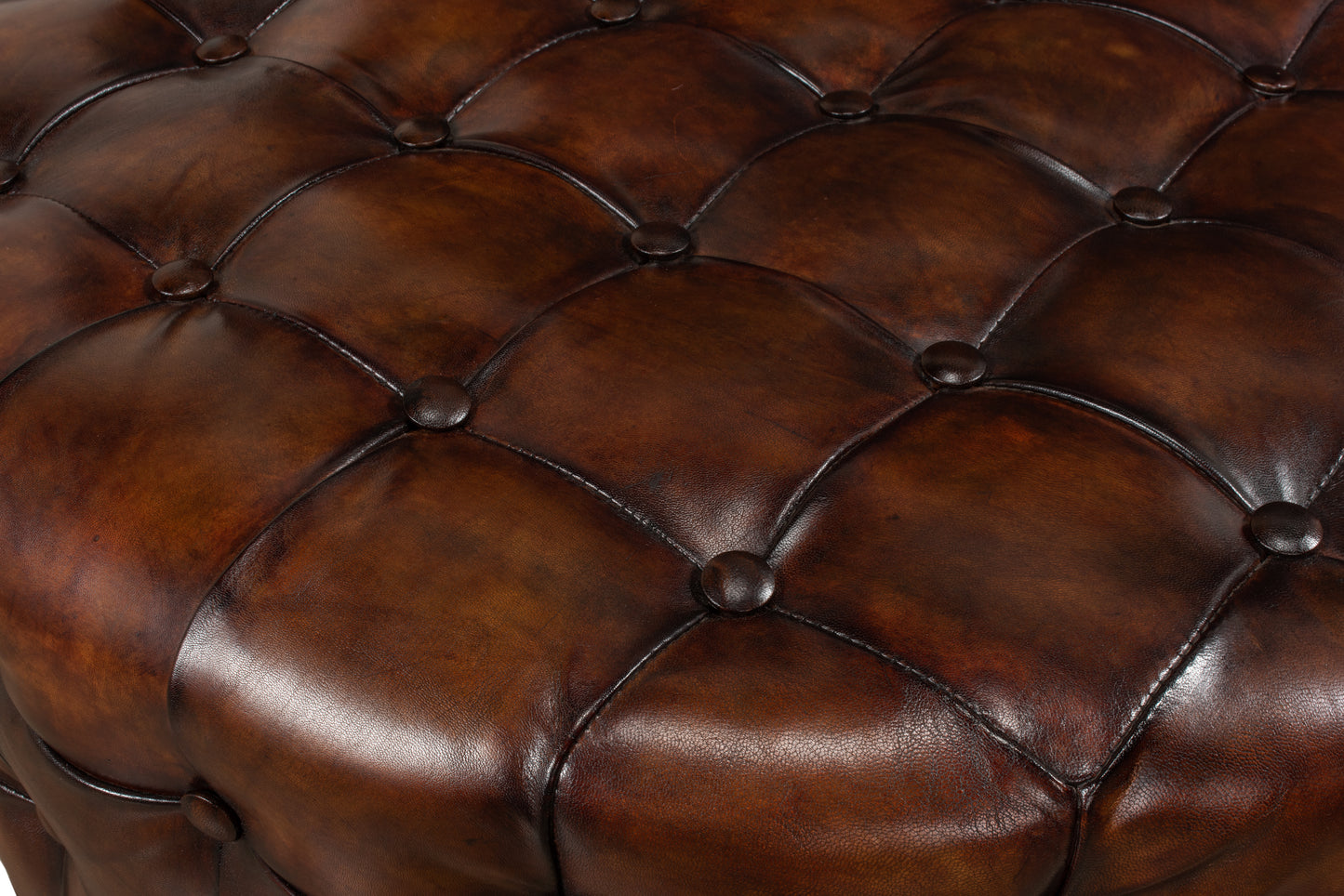 LEATHER TUFTED OTTOMAN
