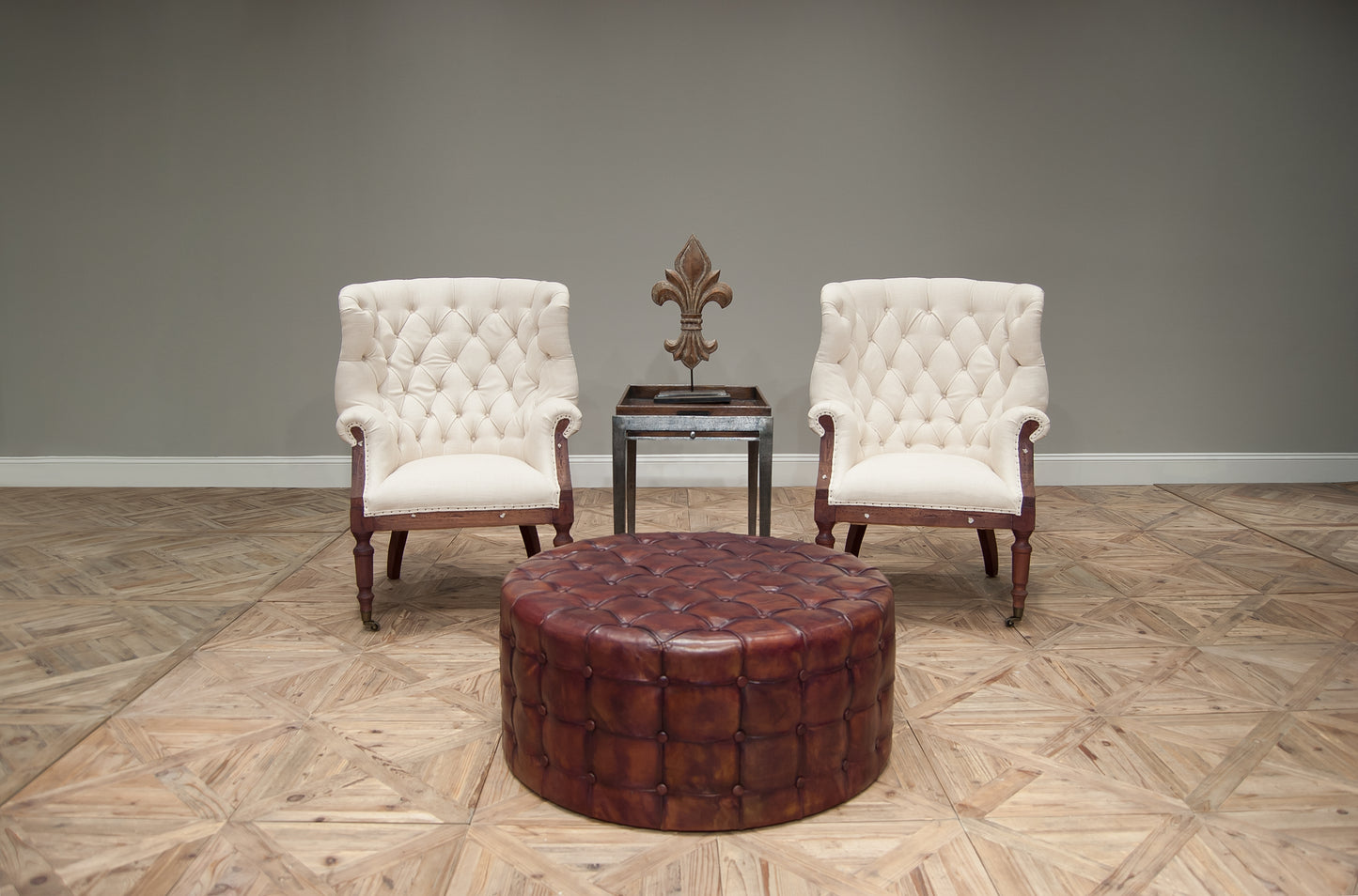 LEATHER TUFTED OTTOMAN